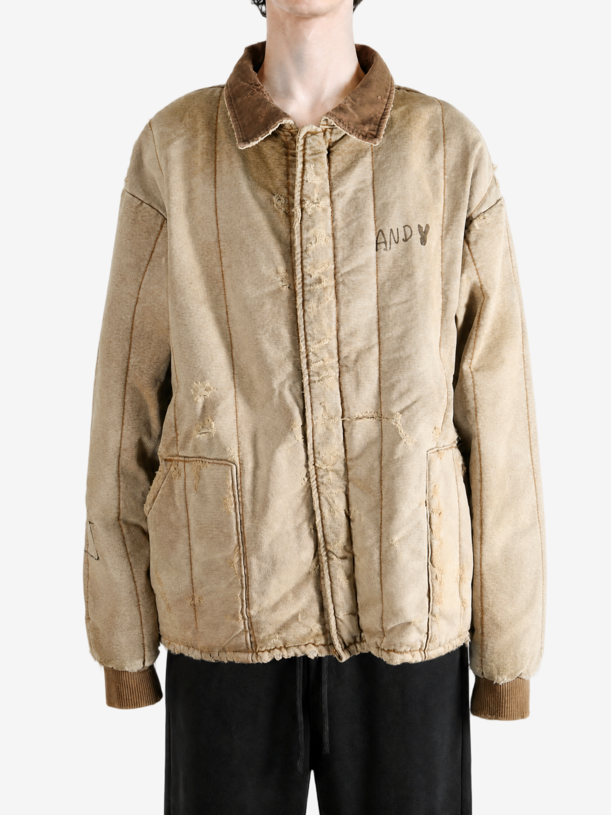 Tan jacket worn by a person, showing the jacket fit