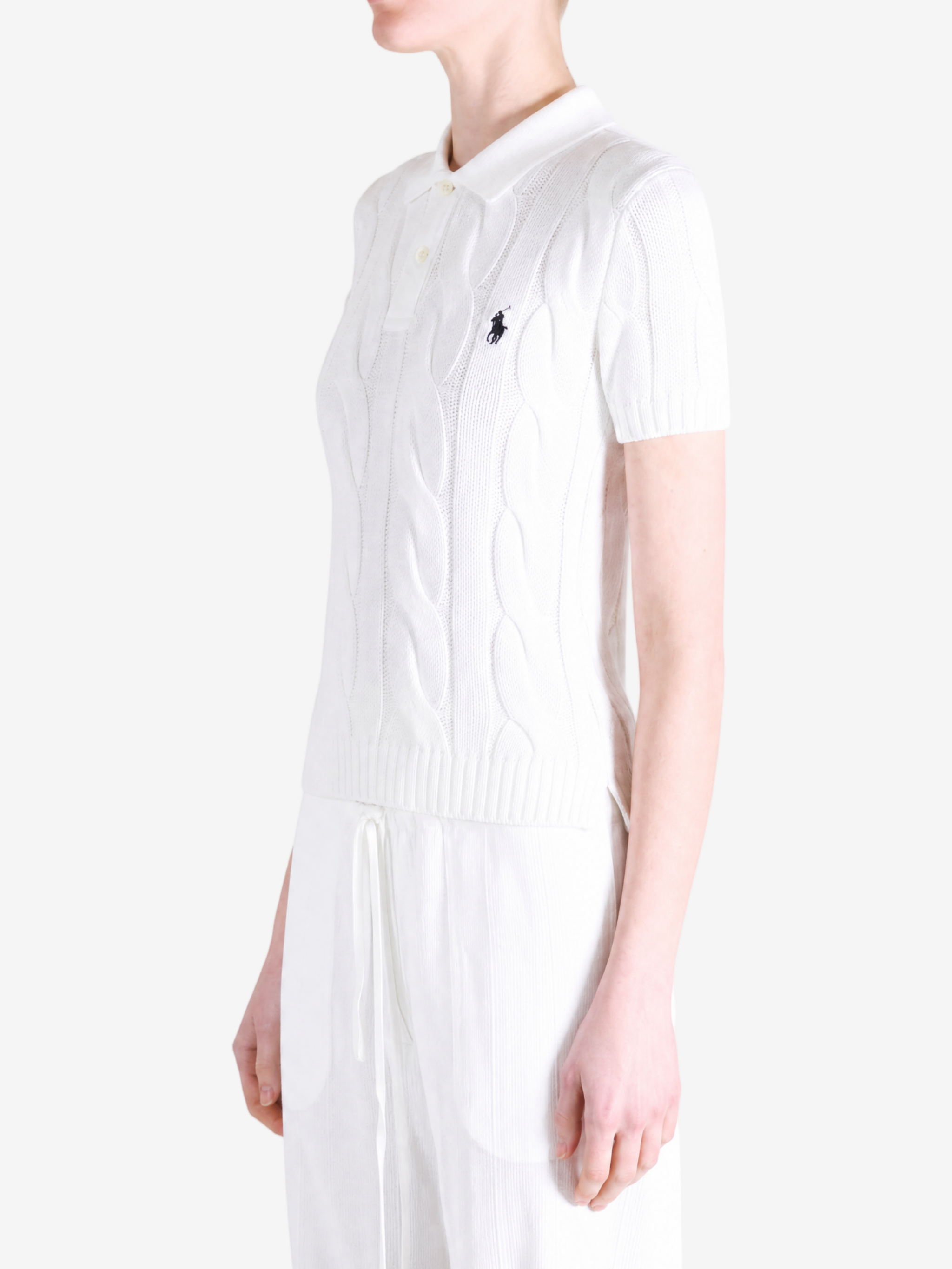 White t-shirt worn by a person, showing the t-shirt fit