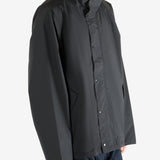 Black jacket worn by a person, showing the jacket's fit