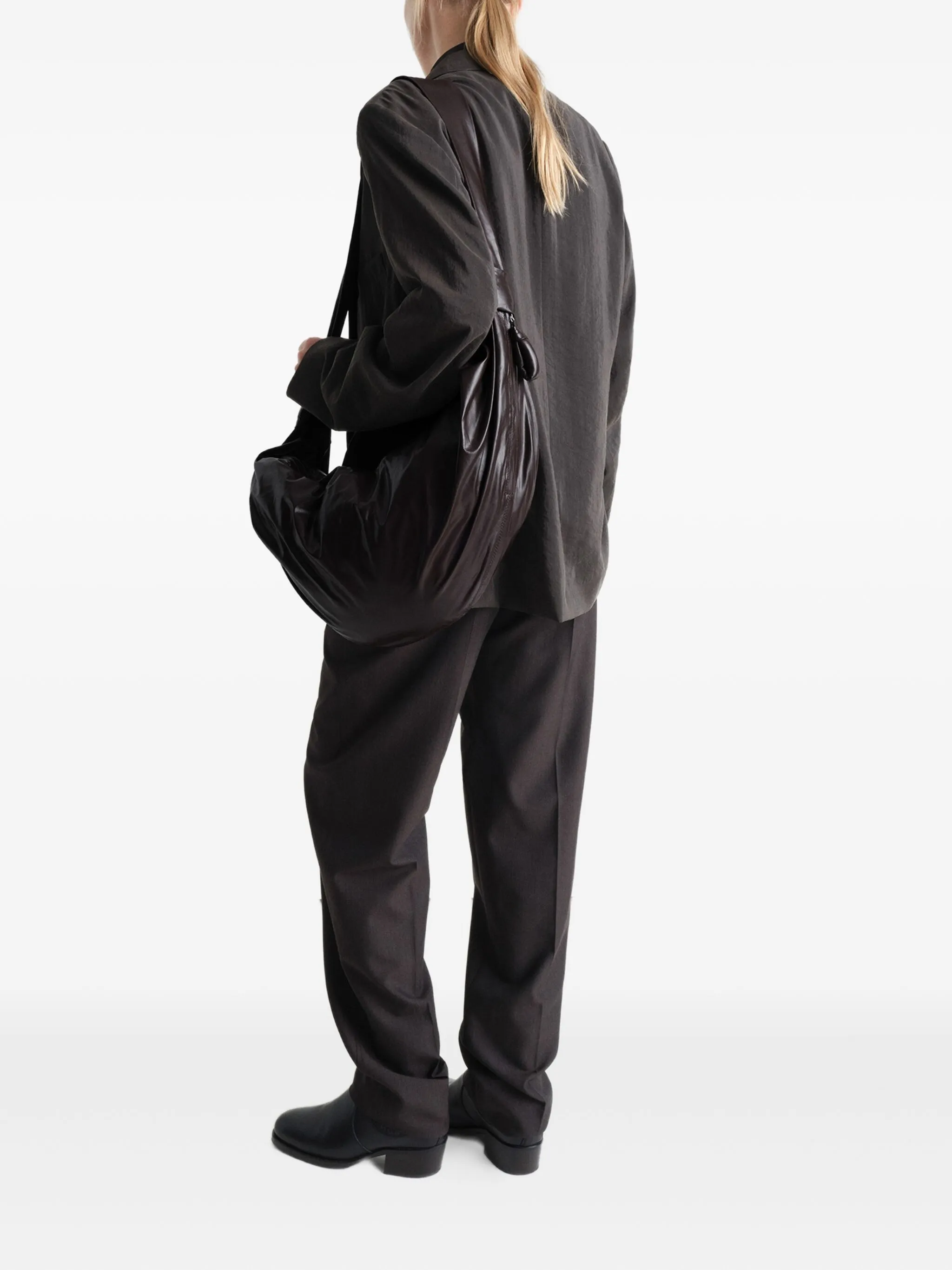 brown bag worn by a person, showing the bag's fit