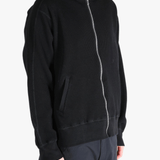 Black hoodie worn by a person, showing the hoodie's fit
