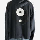 Black hoodie worn by a person, showing the hoodie's fit