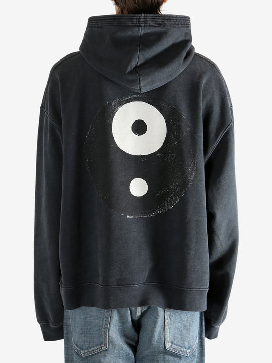 Black hoodie worn by a person, showing the hoodie's fit