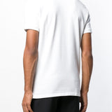 White shirt worn by a person, showing the shirt fit
