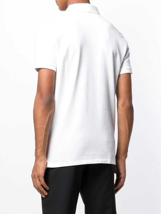 White shirt worn by a person, showing the shirt fit