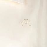 Close up of Tan jacket, showing texture of the 100% polyester fabric