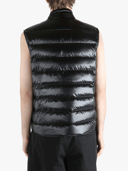 Black top worn by a person, showing the top's fit