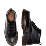 Close up of black shoes, showing texture of the leather fabric