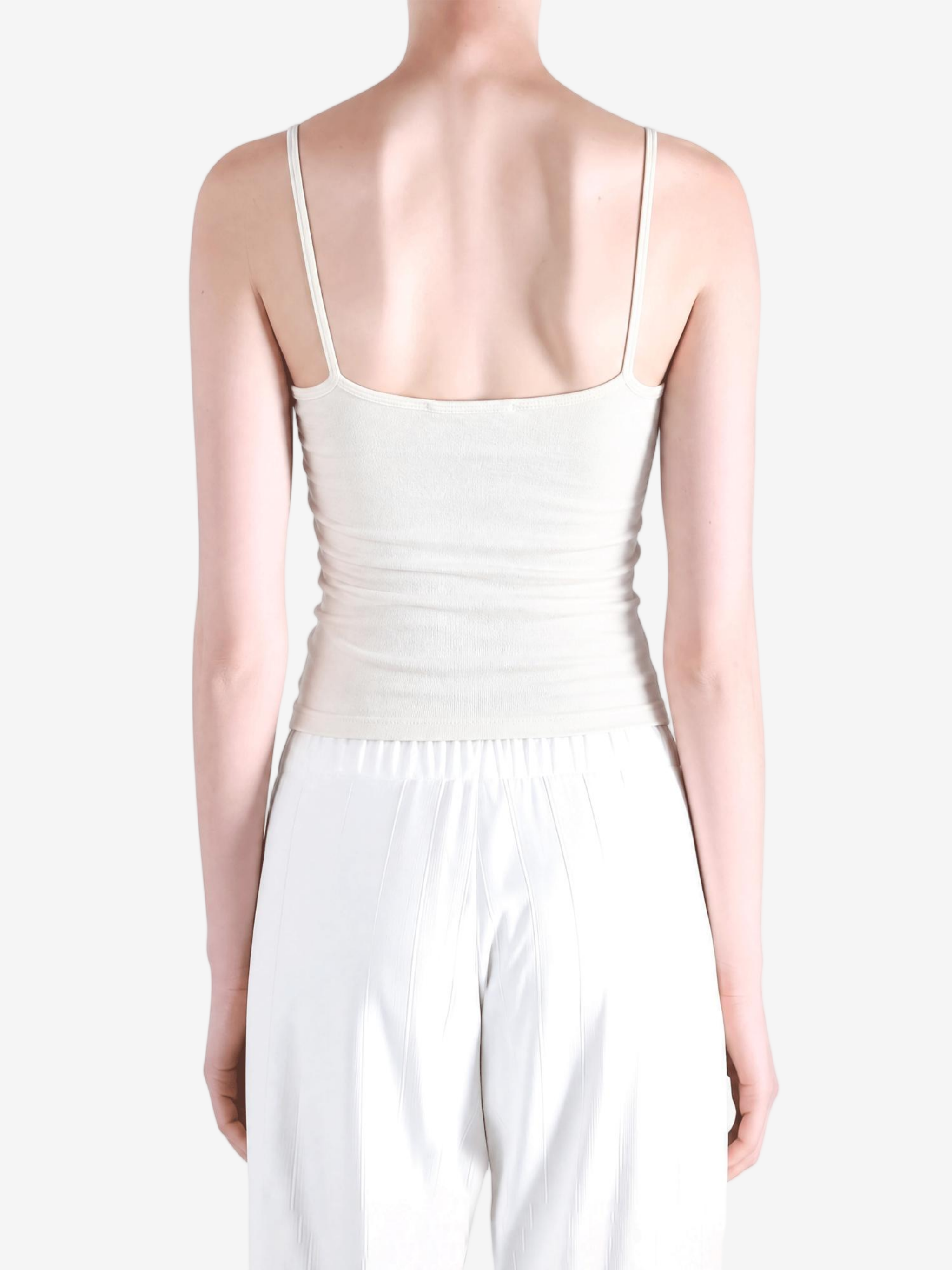 White top worn by a person, showing the top fit