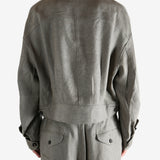 Grey jacket worn by a person, showing the jacket's fit