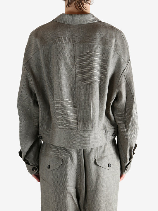 Grey jacket worn by a person, showing the jacket's fit