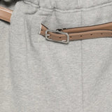 Close up of grey pants, showing texture of the cotton fabric