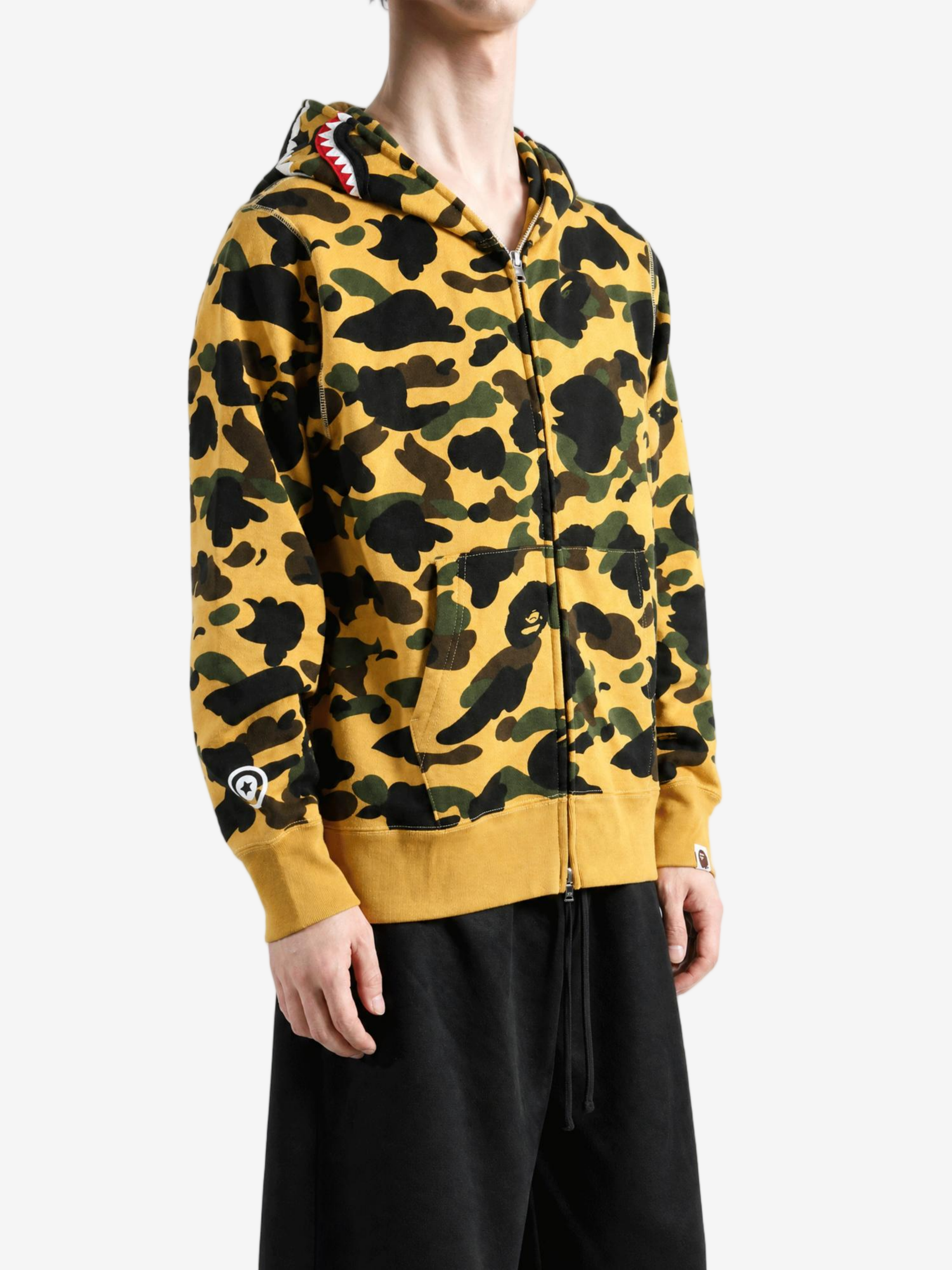 Yellow hoodie worn by a person, showing the hoodie fit
