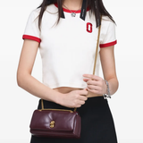 Brown bag worn by a person, showing the bag fit