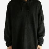 Black hoodie worn by a person, showing the hoodie's fit