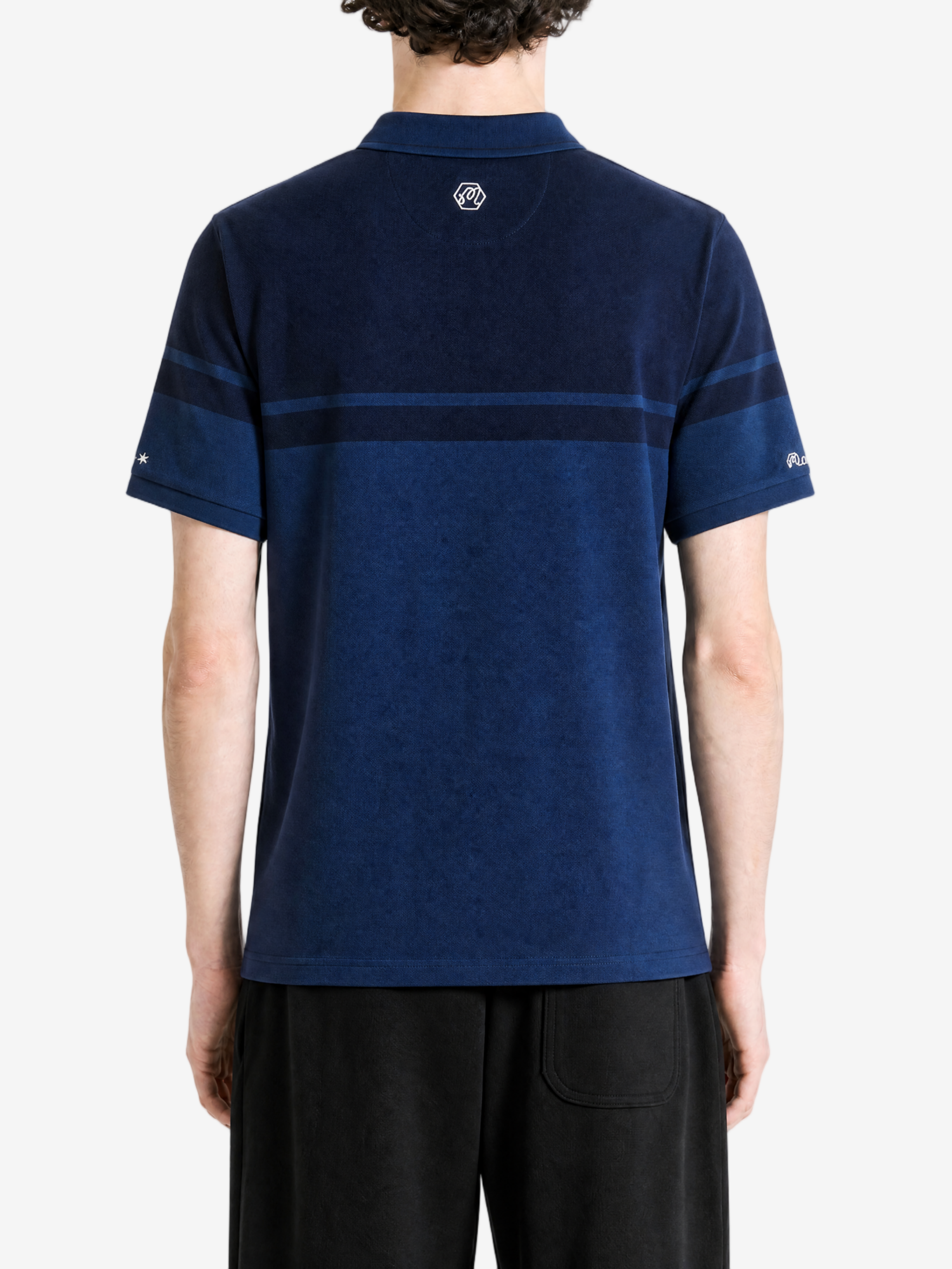 Navy shirt worn by a person, showing the shirt fit