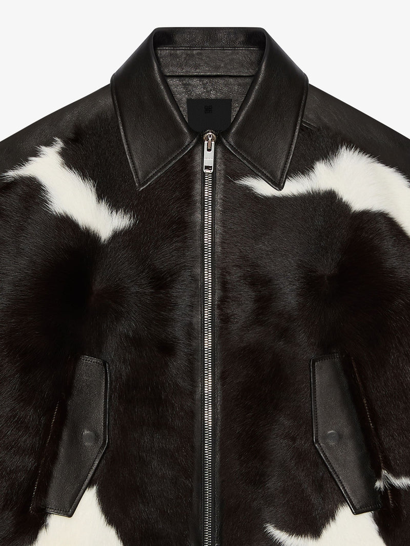 Close up of black jacket, showing texture of the calf leather fabric