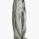 Gray wide-leg pants worn by a person, showing the pants fit