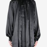 Black shirt worn by a person, showing the shirt fit