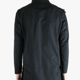 Black jacket worn by a person, showing the jacket's fit