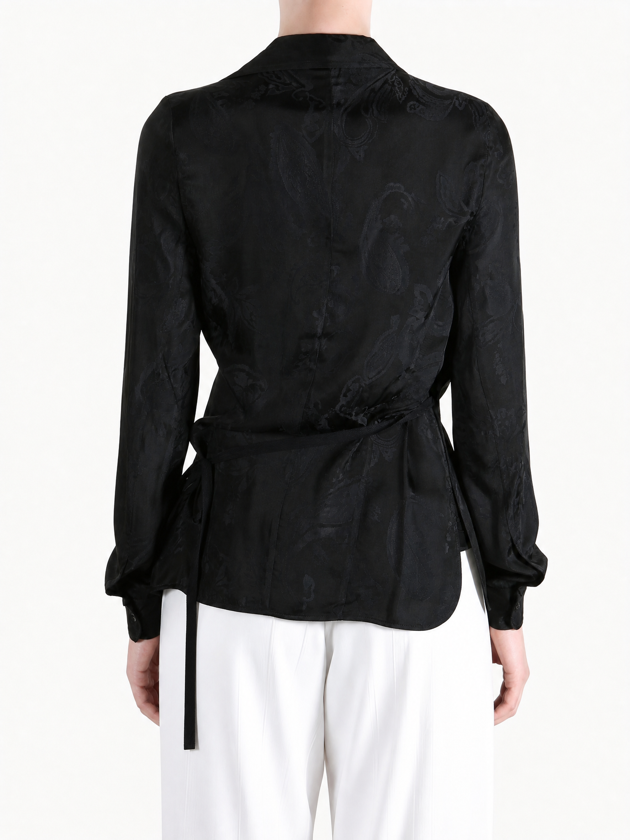 Black shirt worn by a person, showing the shirt fit