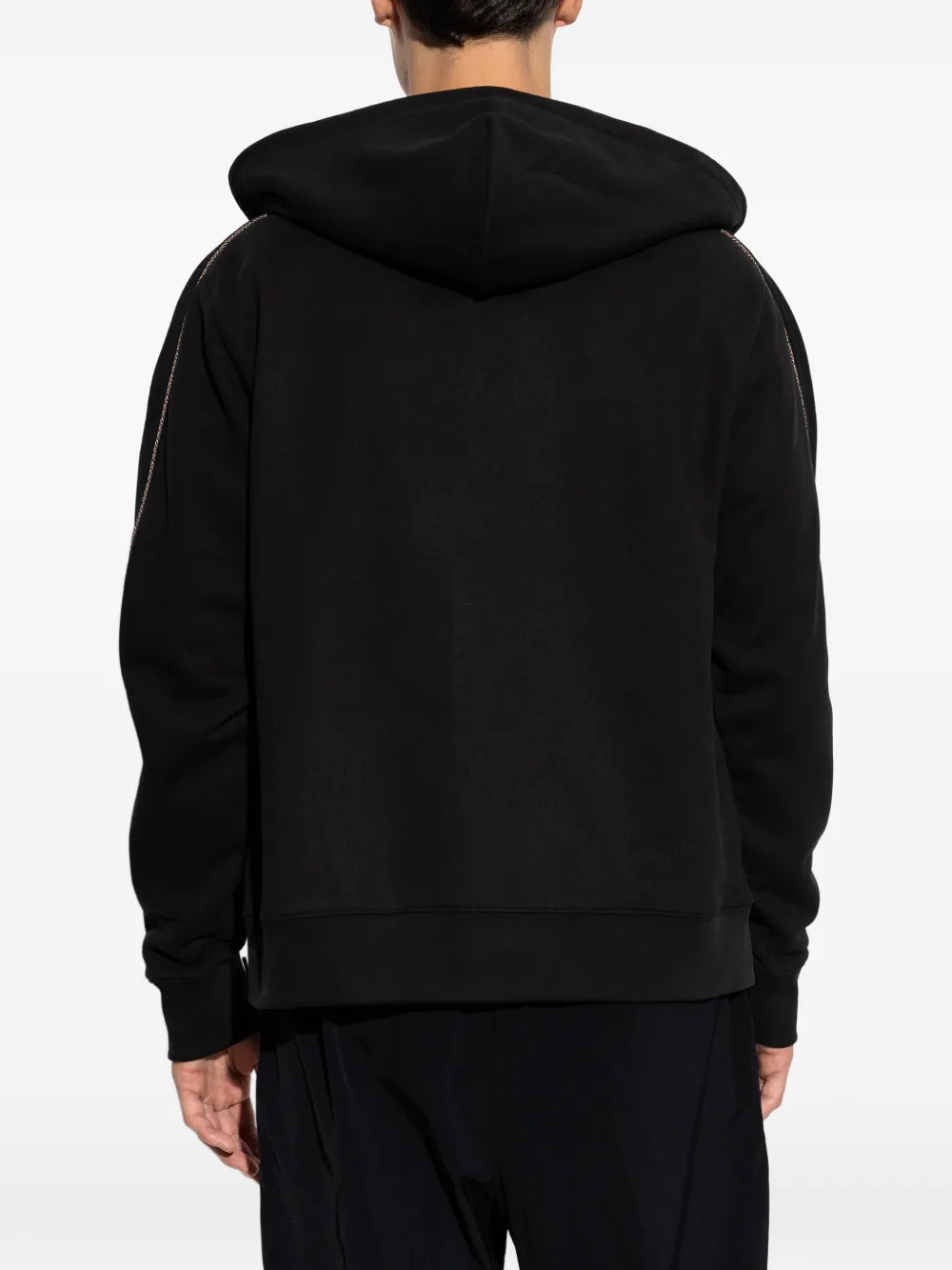 Black hoodies worn by a person, showing the black hoodies' fit
