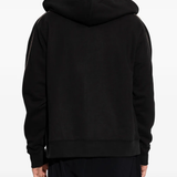 Black hoodies worn by a person, showing the black hoodies' fit
