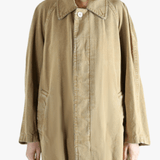 Tan jackets-coats worn by a person, showing the jackets-coats'fit