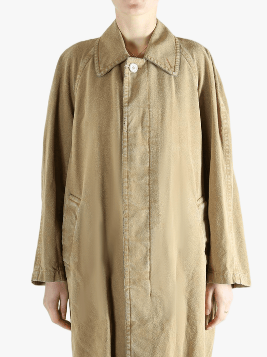 Tan jackets-coats worn by a person, showing the jackets-coats'fit