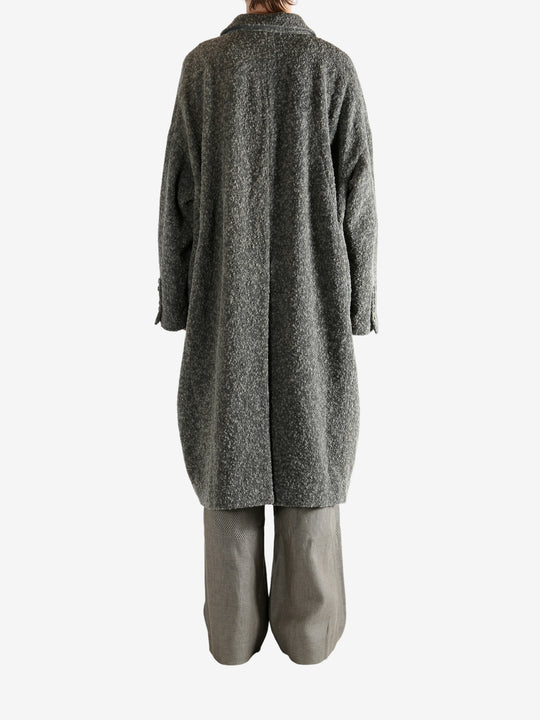 Grey coat worn by a person, showing the coat's fit