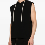Black sleeveless hoodie worn by a person, showing the shirt's fit