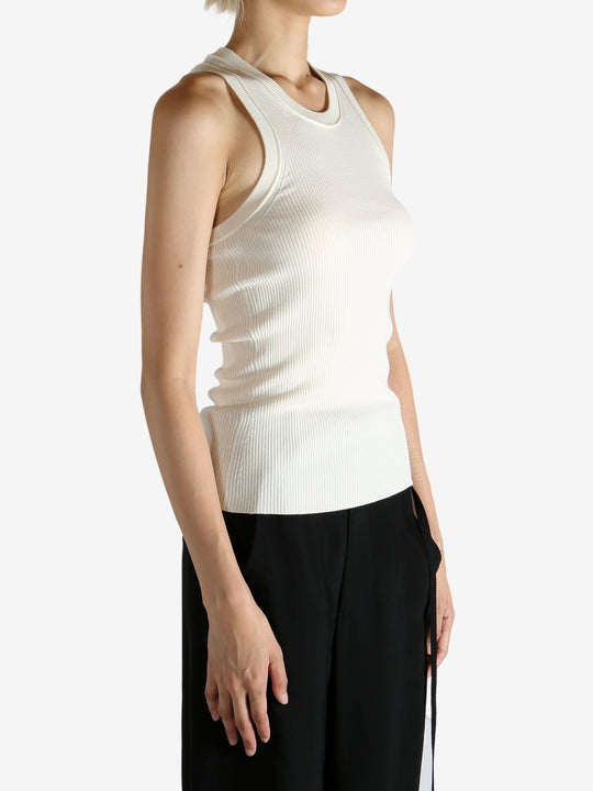 Tan top worn by a person, showing the top fit