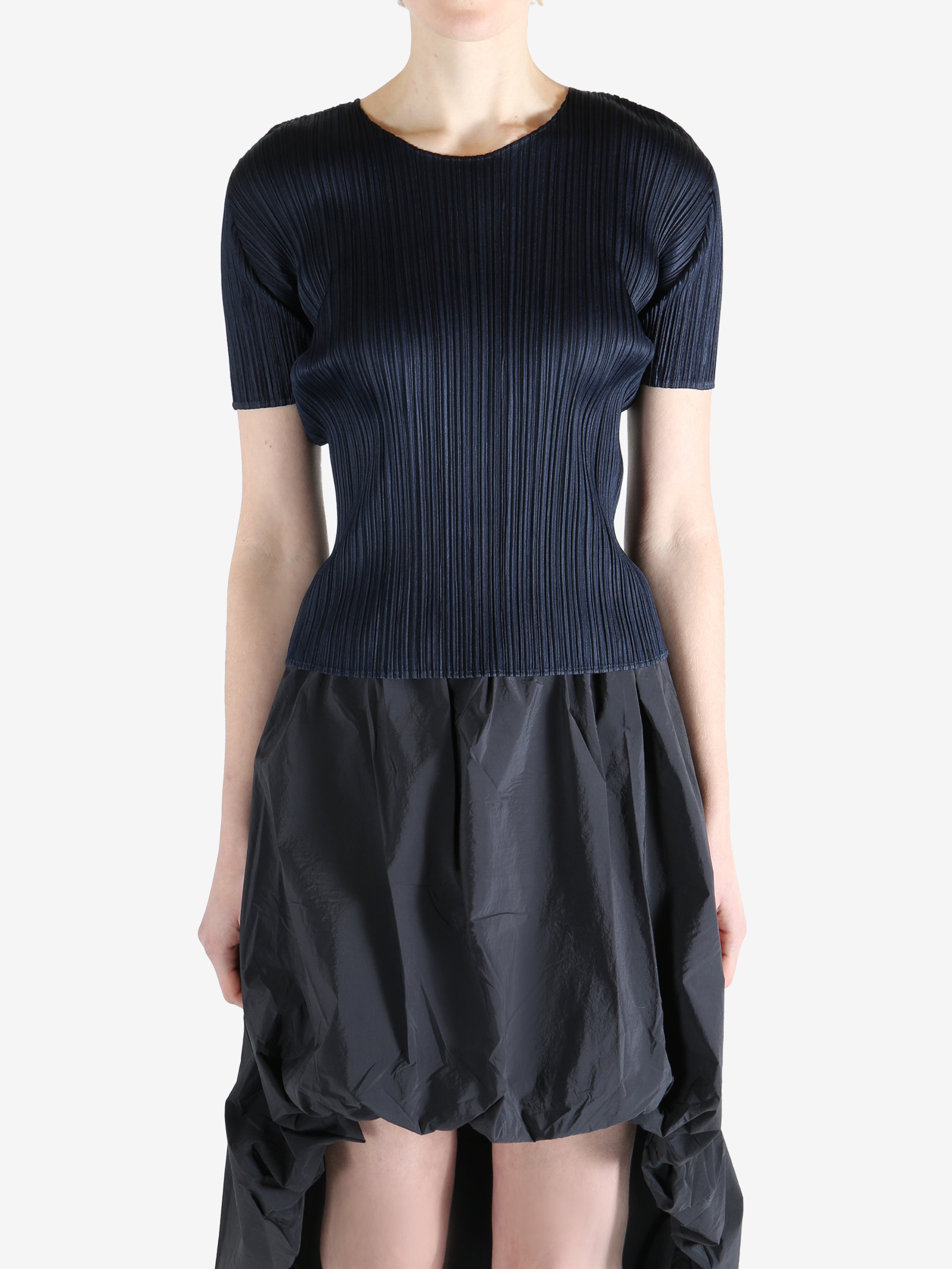 Navy top worn by a person, showing the top's fit