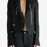 Black jacket worn by a person, showing the  jacket fit