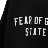 Close up of the black sweatshirt, showing texture of the cotton fabric