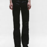 Black pants worn by a person, showing the pants fit