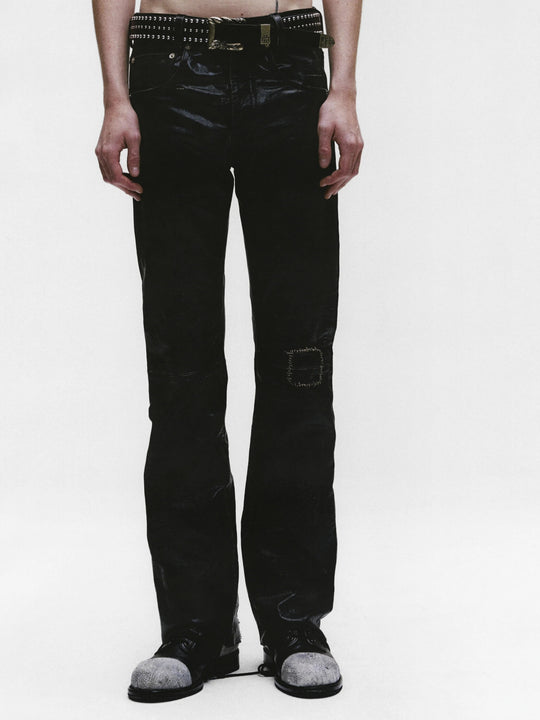 Black pants worn by a person, showing the pants fit