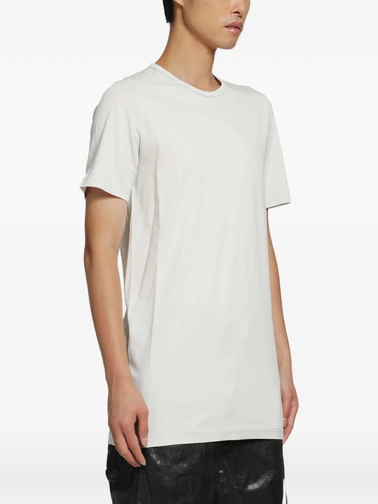 White t-shirt worn by a person, showing the t-shirt fit