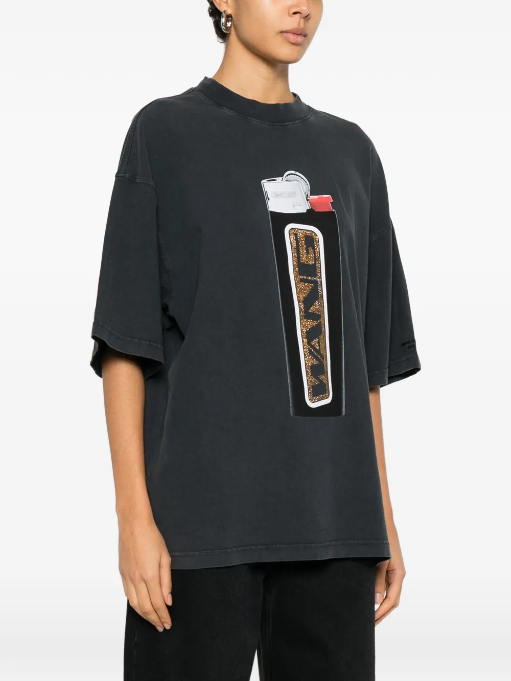 black t-shirts worn by a person, showing the t-shirts fit