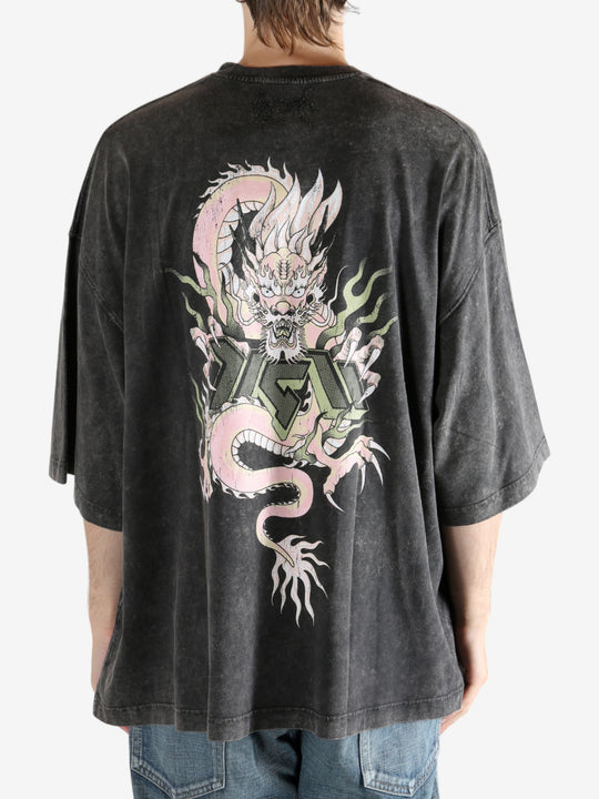 Black t-shirt worn by a person, showing the t-shirt's fit