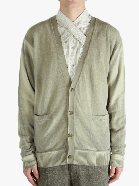 Light green cardigan worn by a person, showing the cardigan fit