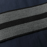 Close up of blue jackets, showing texture of the polyester and duck down fabric