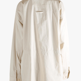 White jacket worn by a person, showing the jacket's fit