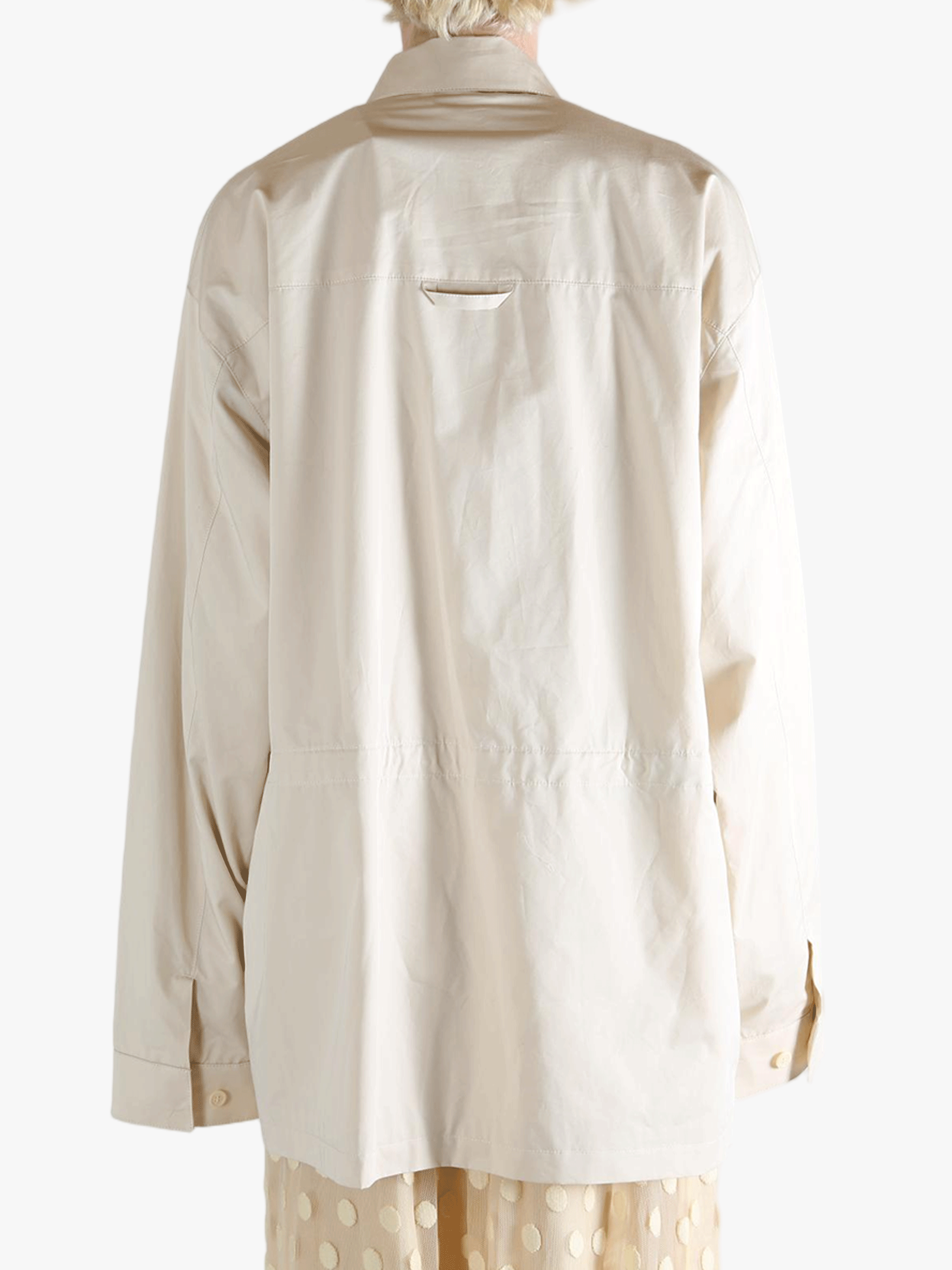 White jacket worn by a person, showing the jacket's fit