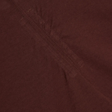 Close up of burgundy t-shirts , showing texture of the organic cotton fabric