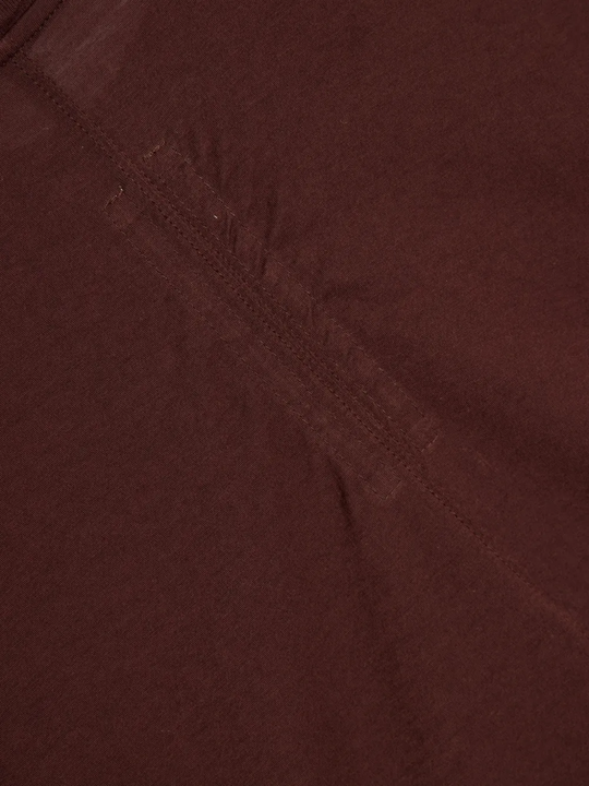 Close up of burgundy t-shirts , showing texture of the organic cotton fabric