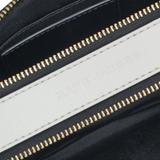 close up of black bags, showing texture of the leather fabric