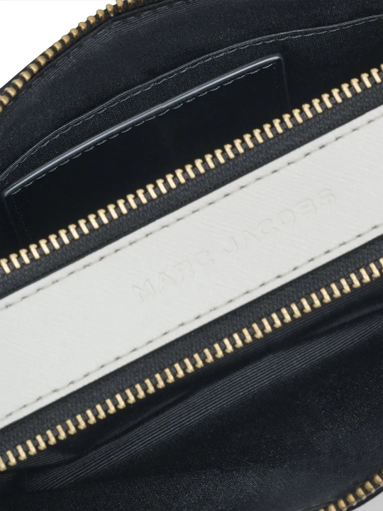 close up of black bags, showing texture of the leather fabric