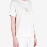 White top worn by a person, showing the top fit