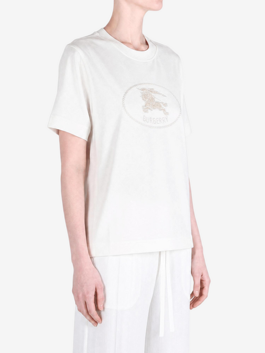 White top worn by a person, showing the top fit